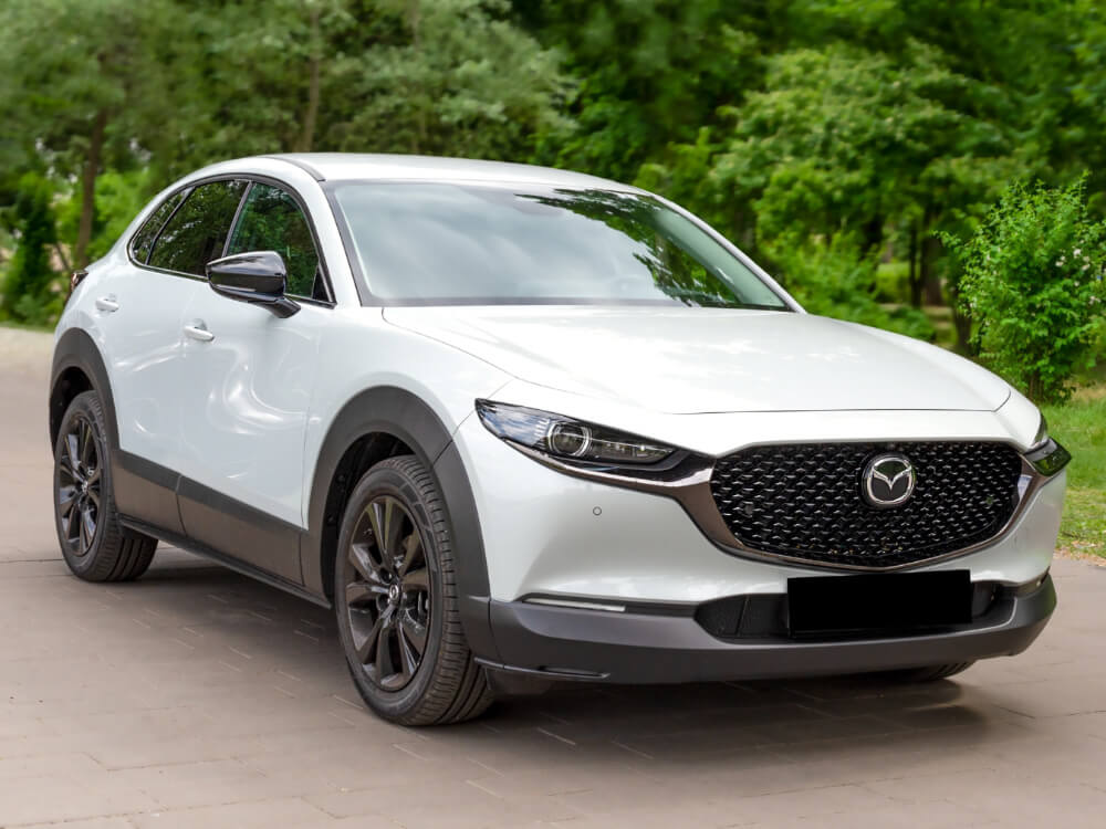What Makes Mazda CX SUVs Different Mazda CX 30 parked on a quiet park road