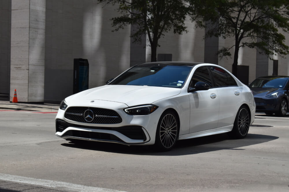 Mercedes-Benz E-Class Generations and the Evolution of a Luxury Sedan Mercedes e class on the road